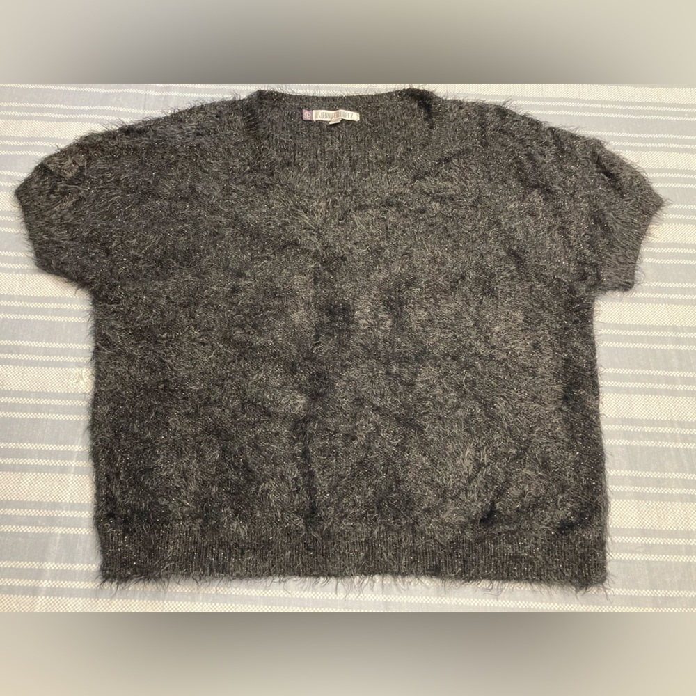Jennifer Lopez black faux fur crop top.